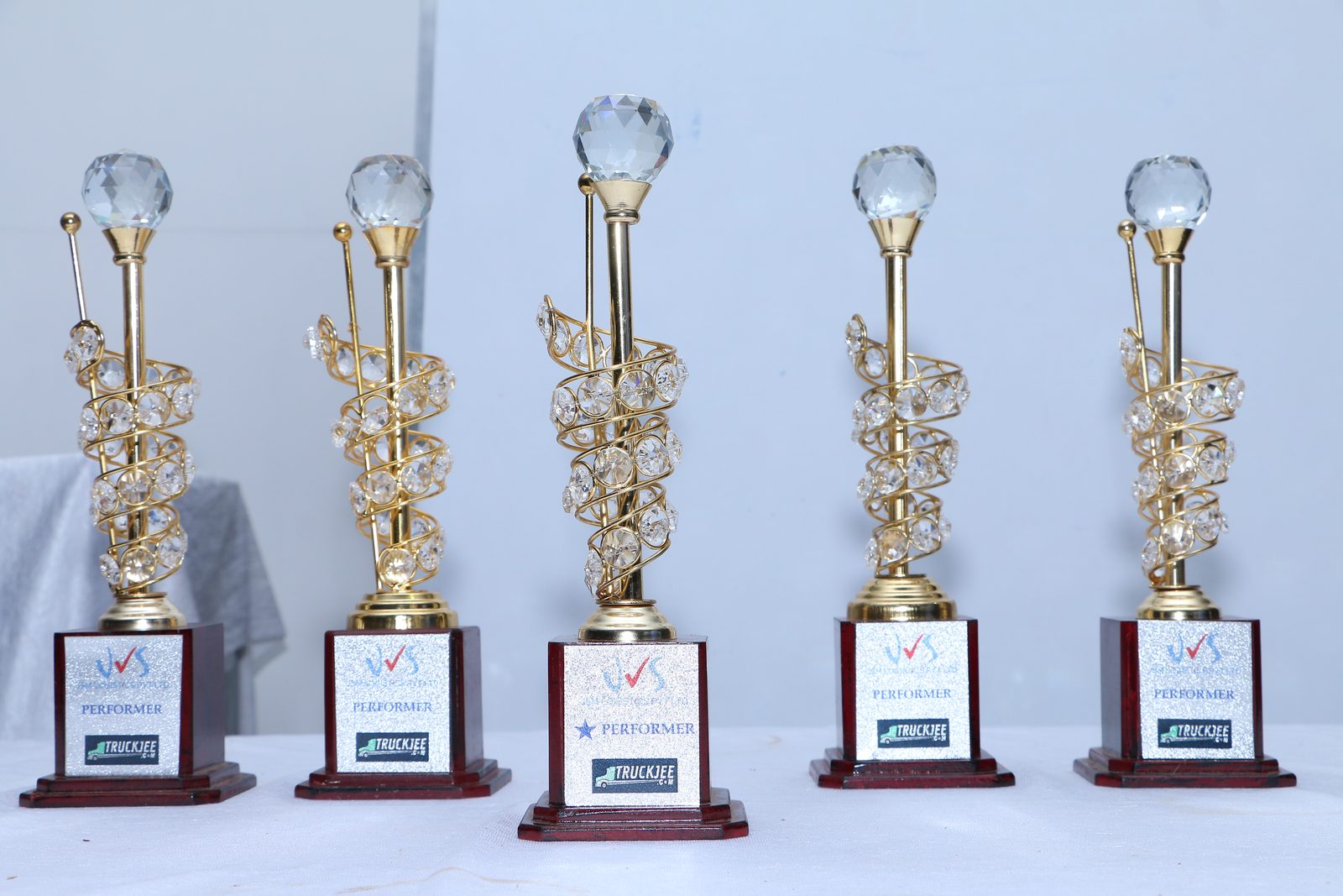 JSM Logistics award trophies displayed at a company recognition event